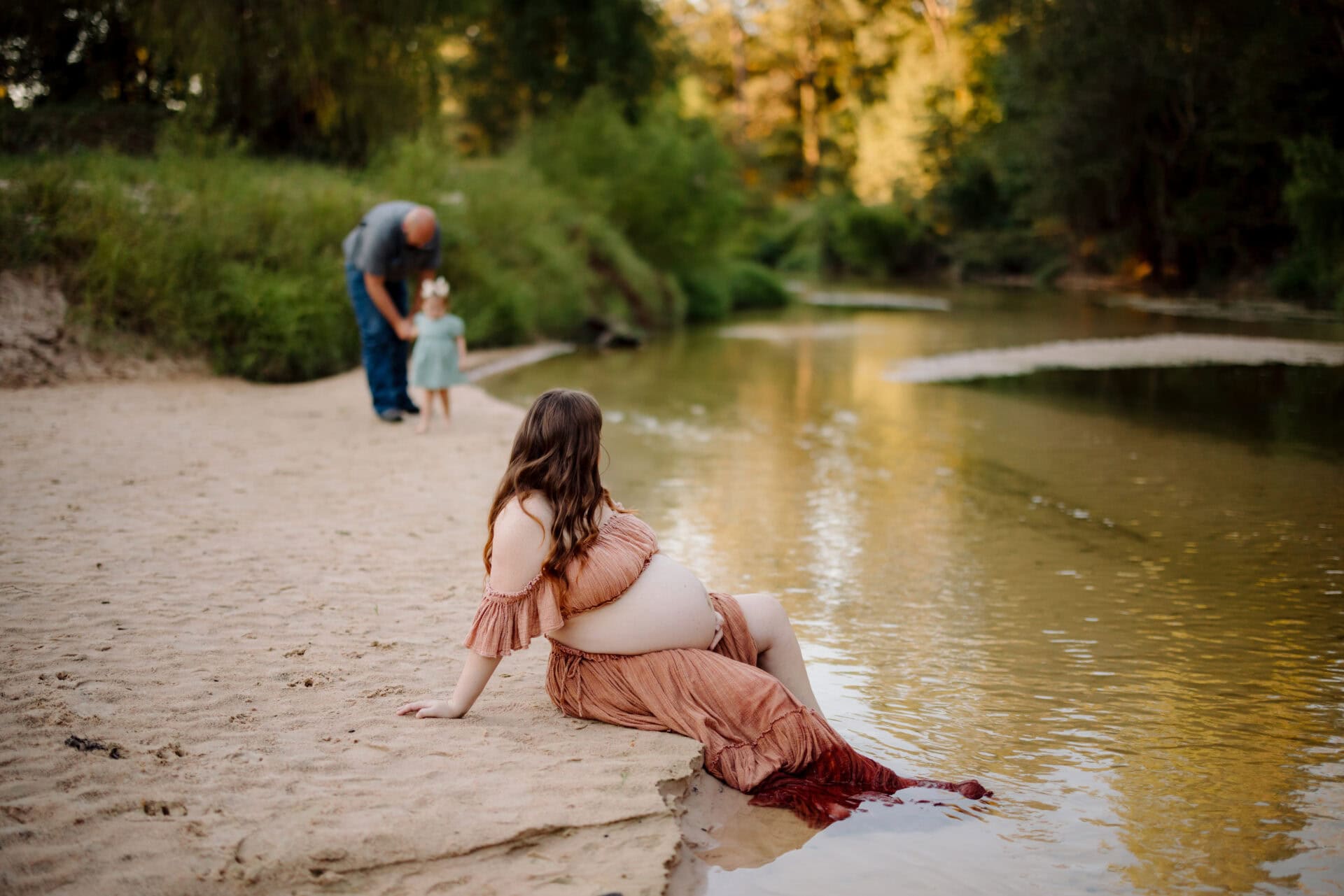 Beautiful maternity photo by Ashley Newman Photography in a private forest setting.