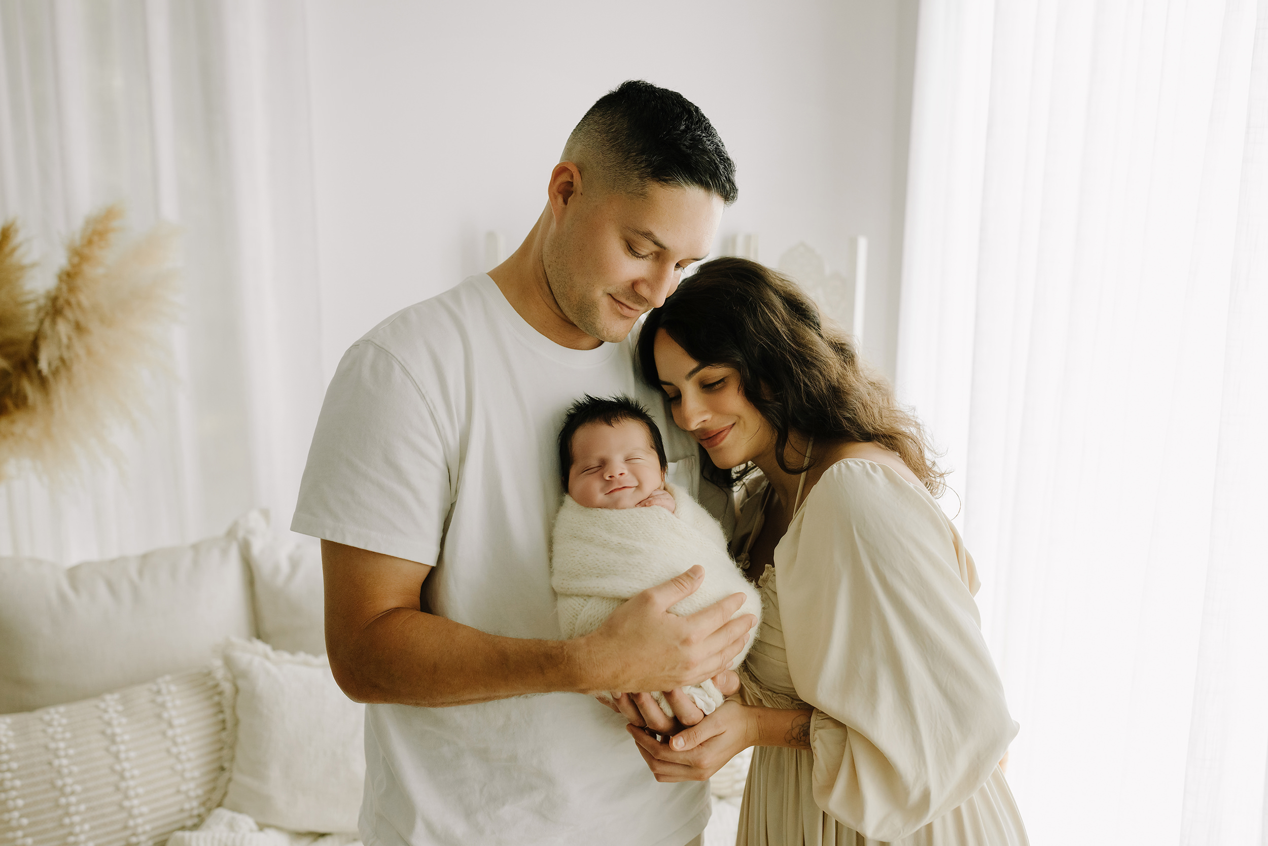 Newborn family portrait in The Woodlands TX with parents and baby.