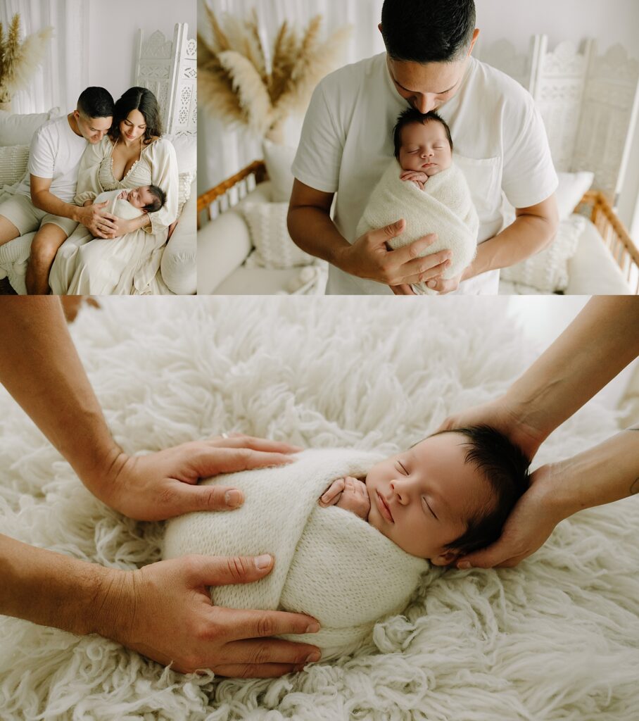 Newborn baby wrapped in a blanket with parents in a cozy studio setting.