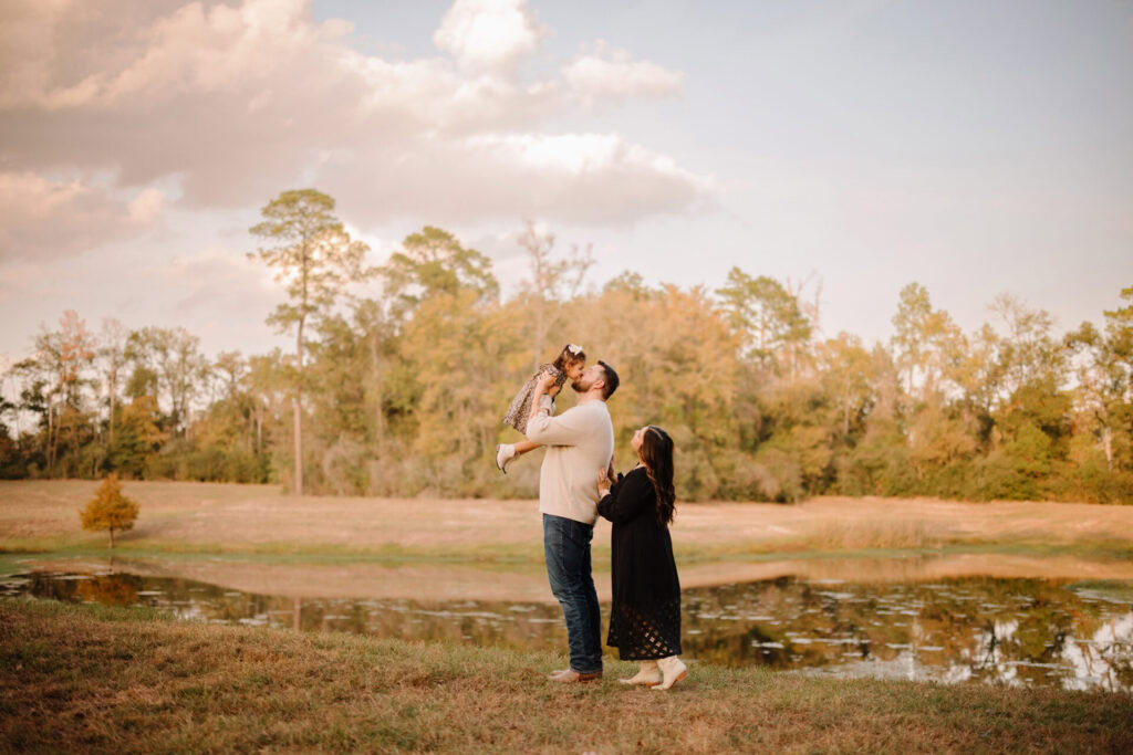 Family portrait in a park during autumn.
