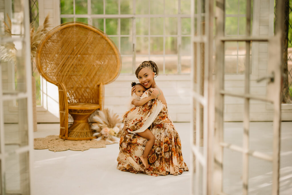 Mother and daughter sharing a warm hug in a bright, airy room with natural light.